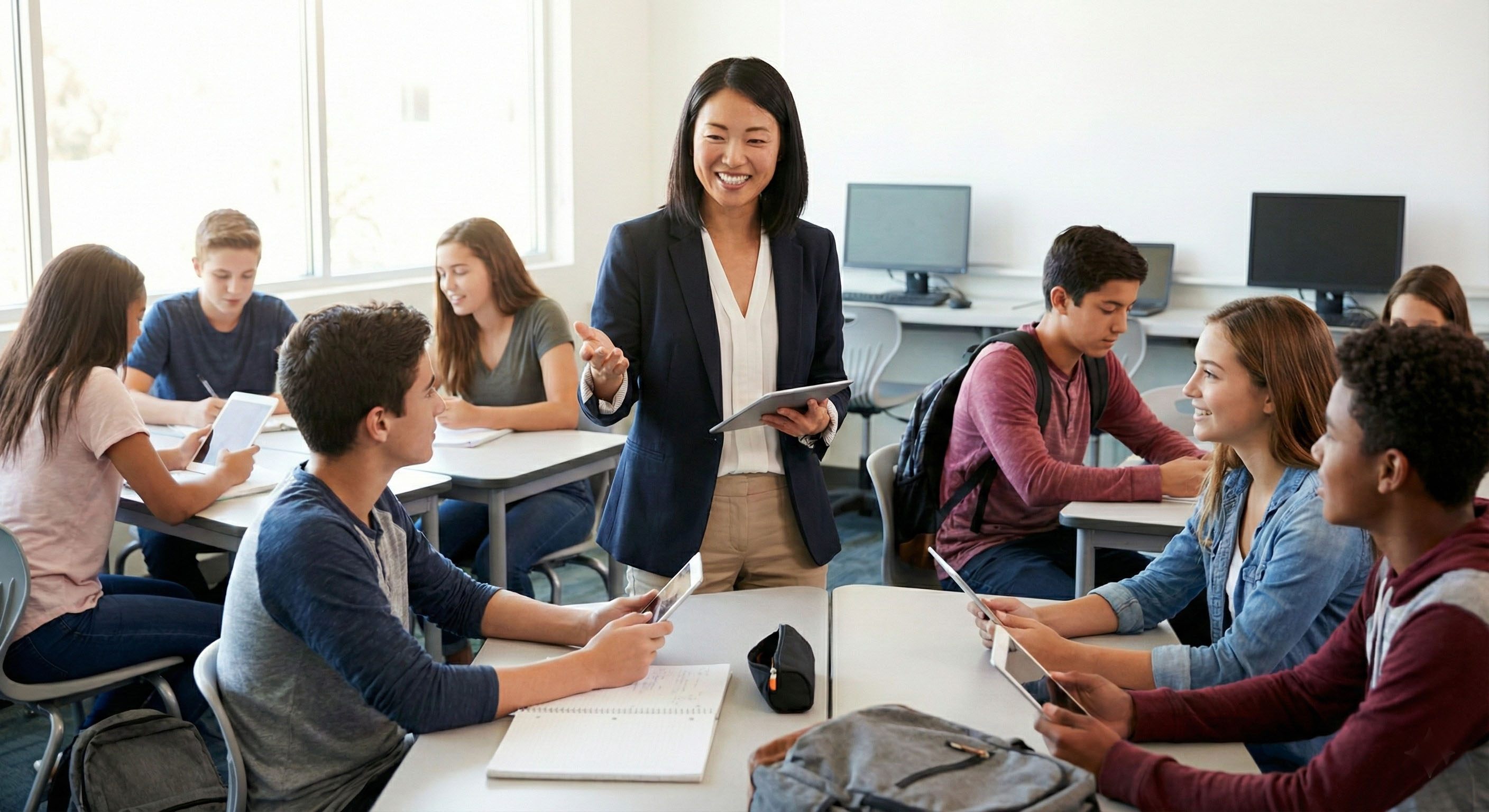 Teacher leading a classroom using tablets